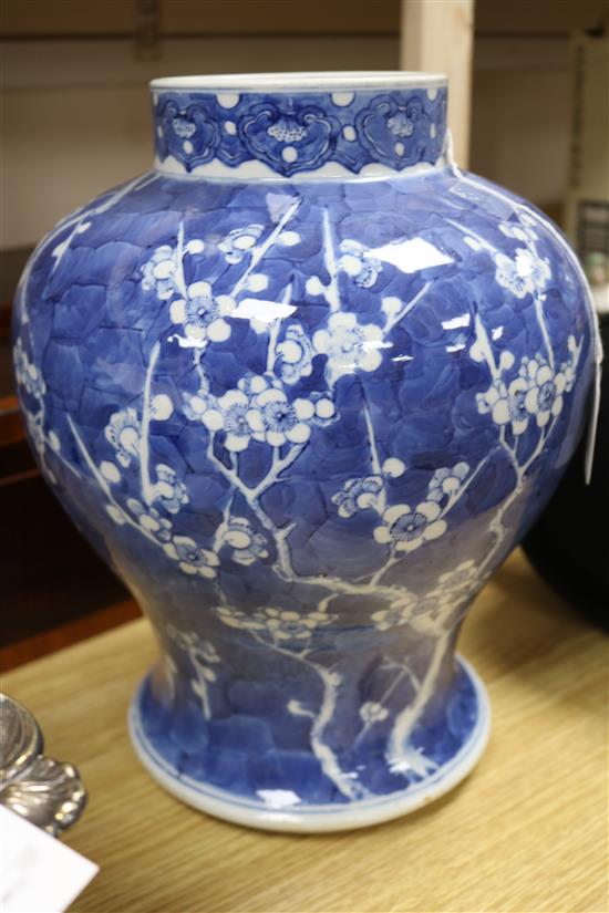 A 19th century Chinese large blue and white baluster vase decorated with prunus